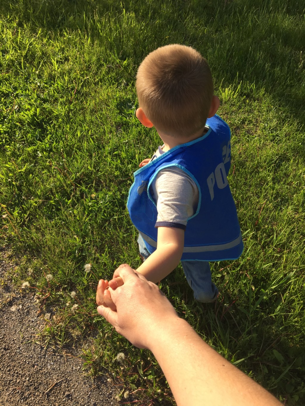 Son holding mom's hand, adoption