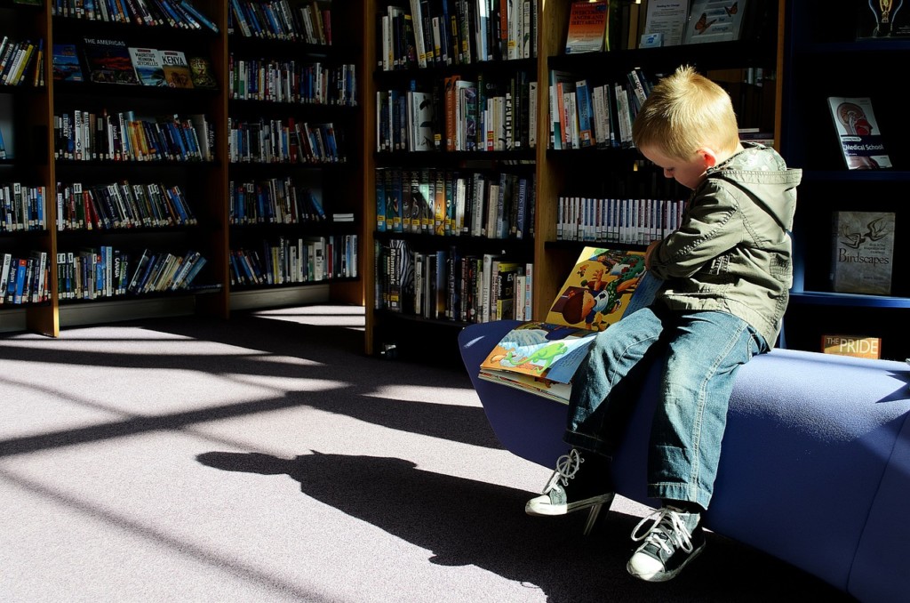 child at library, library