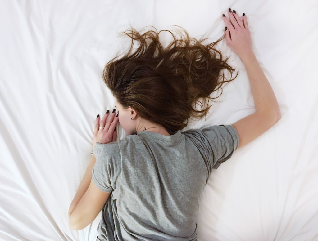 tired woman on bed, new moms