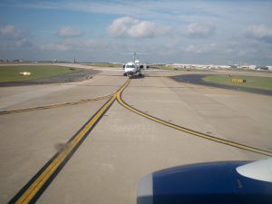 airport runway, partly cloudy day