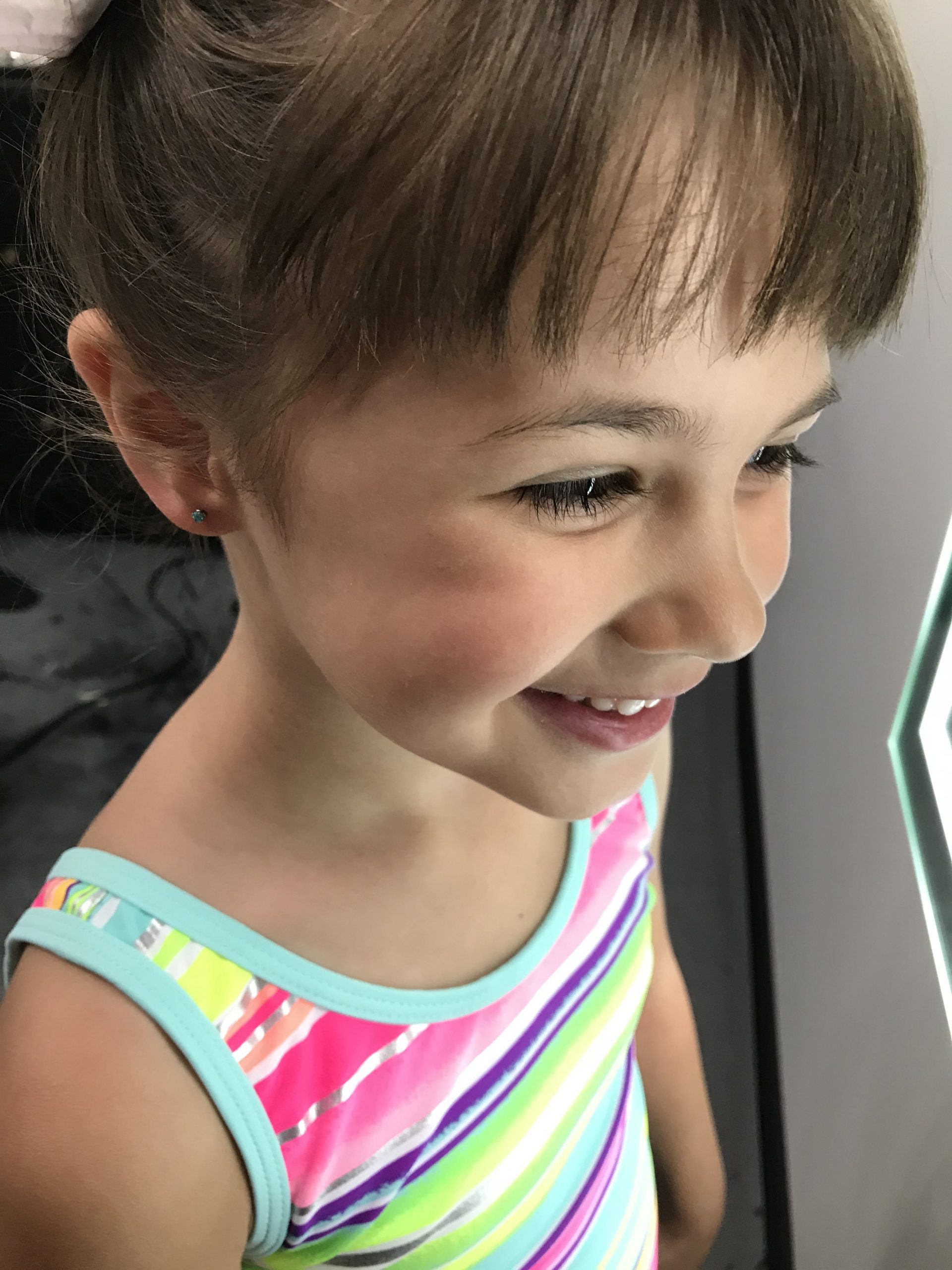 piercings, needle, ear piercings, earrings child with a new ear piercing