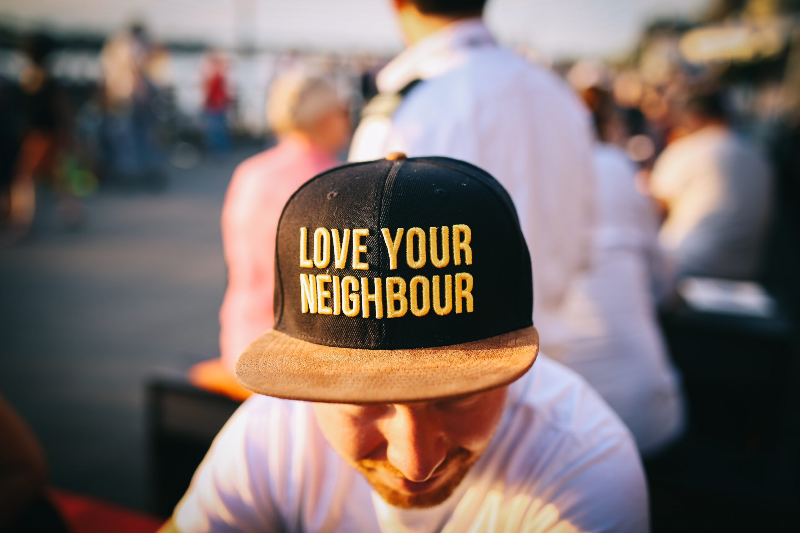 neighbors, neighboring, neighborhood, community, family man with a "love you neighbor" hat